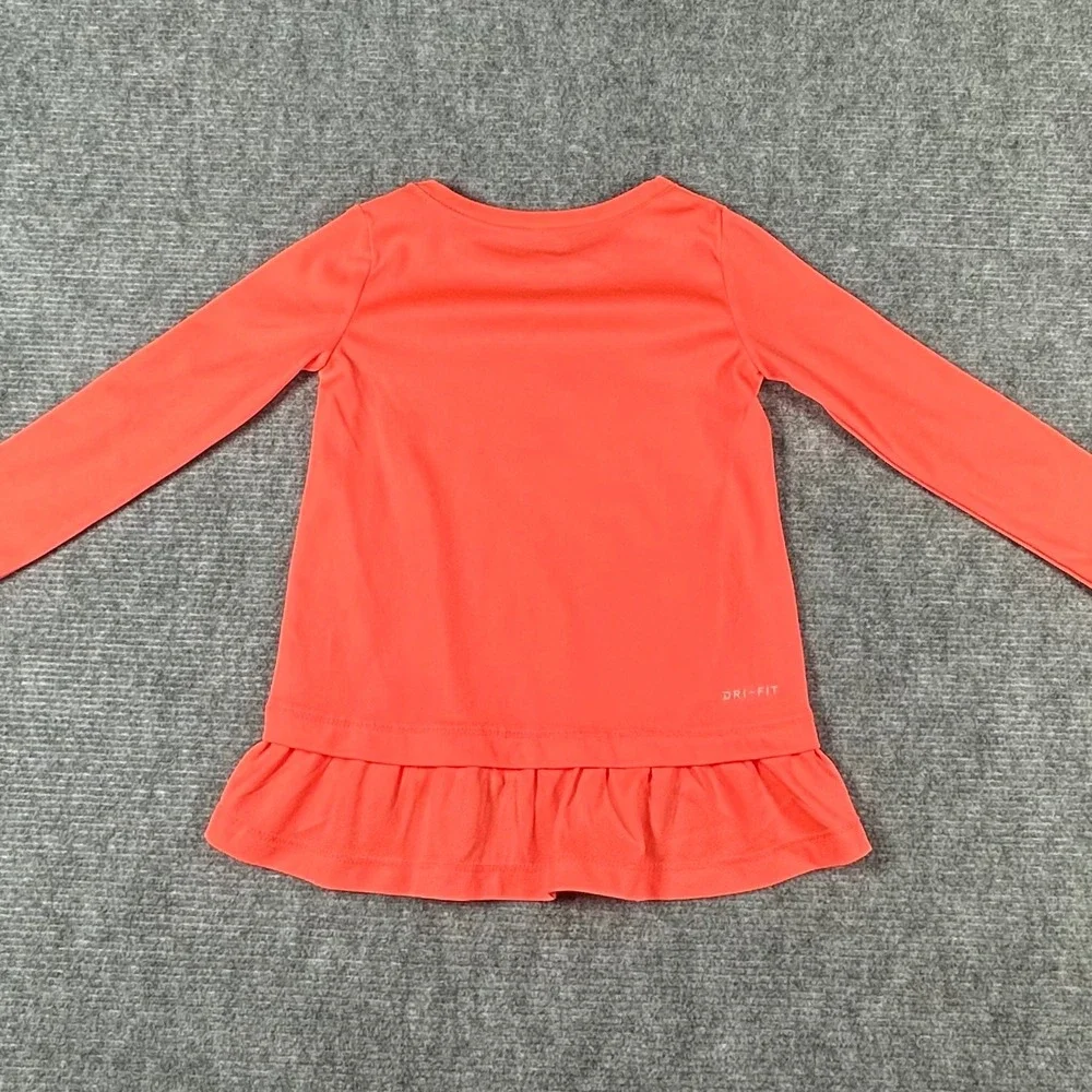 Nike Kids Dri-FIT Long Sleeve Peplum Ruffle Top Coral Pink Iridescent Swoosh